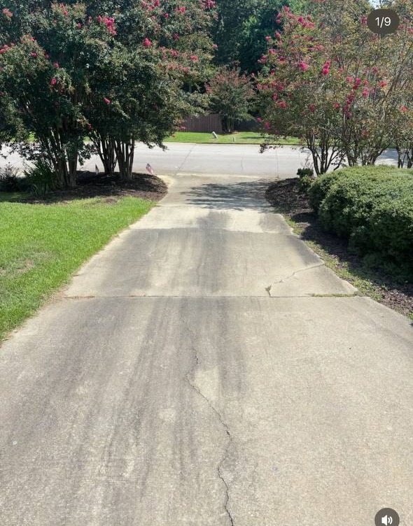 Dirty driveway before Top Tier Exteriors
