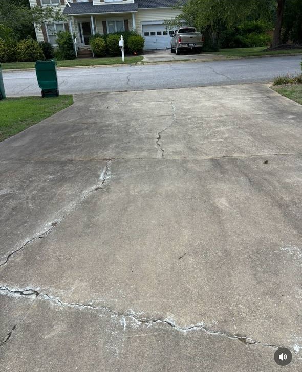 Weathered driveway before Top Tier Exteriors